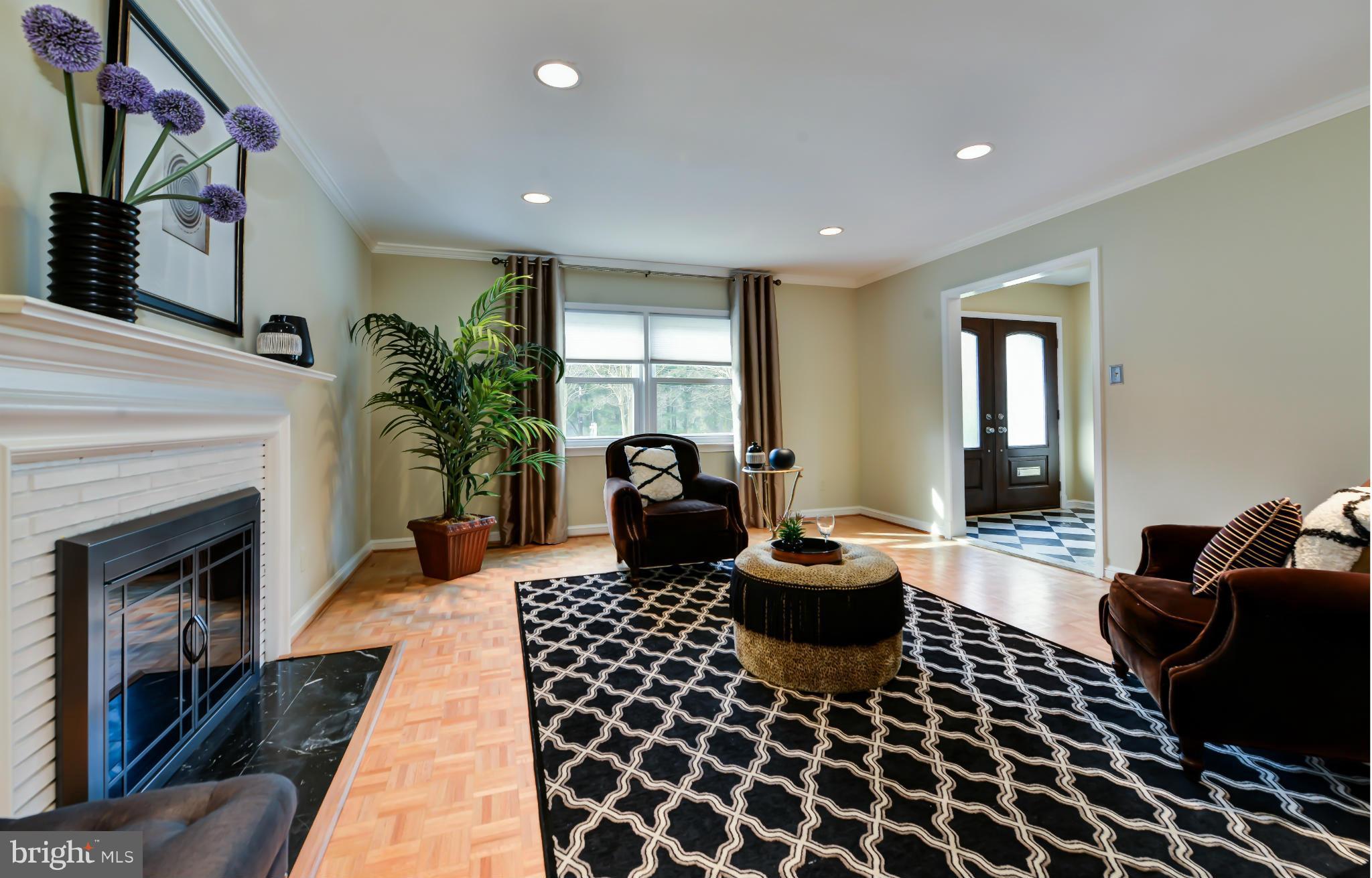 7303 Fort Hunt Road Alexandria, VA 22307 - Photo 14 of 30 a living room with furniture and a fireplace