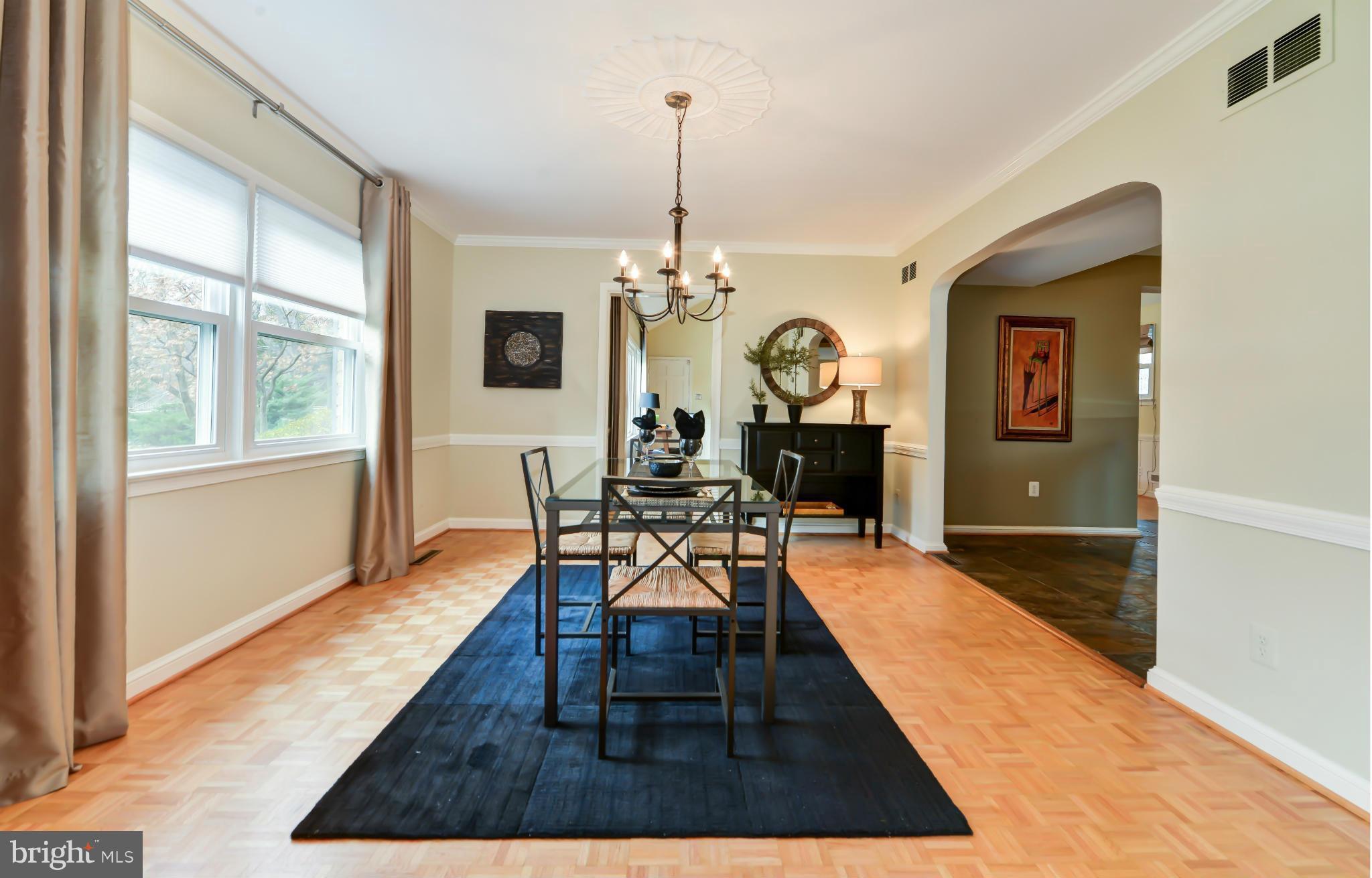 7303 Fort Hunt Road Alexandria, VA 22307 - Photo 15 of 30 a living room with furniture a rug and a chandelier