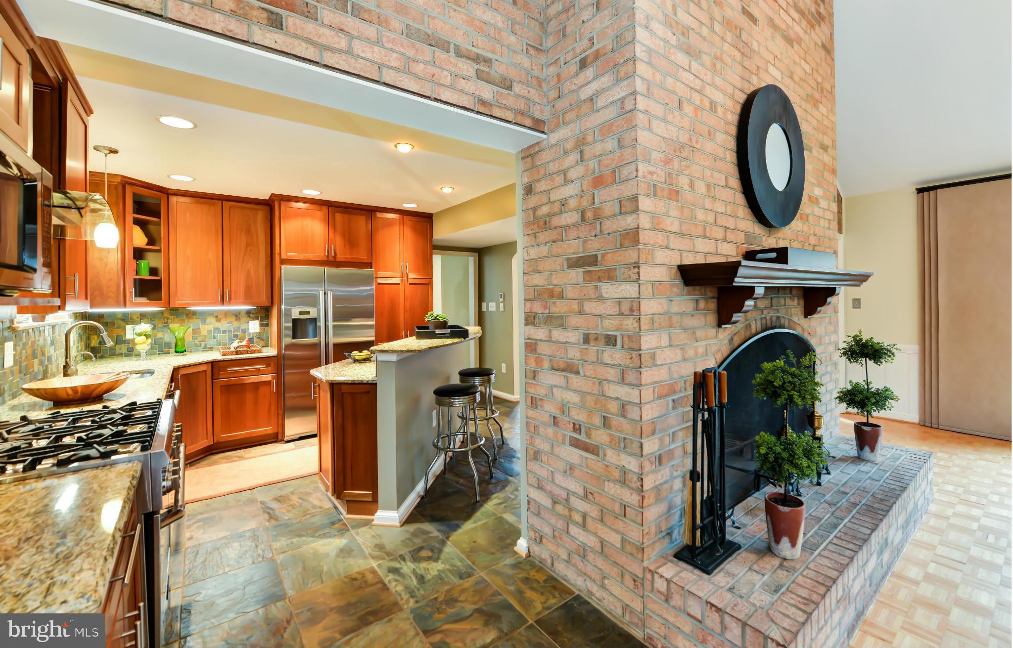 7303 Fort Hunt Road Alexandria, VA 22307 - Photo 16 of 30 a living room with fireplace furniture and a floor to ceiling window