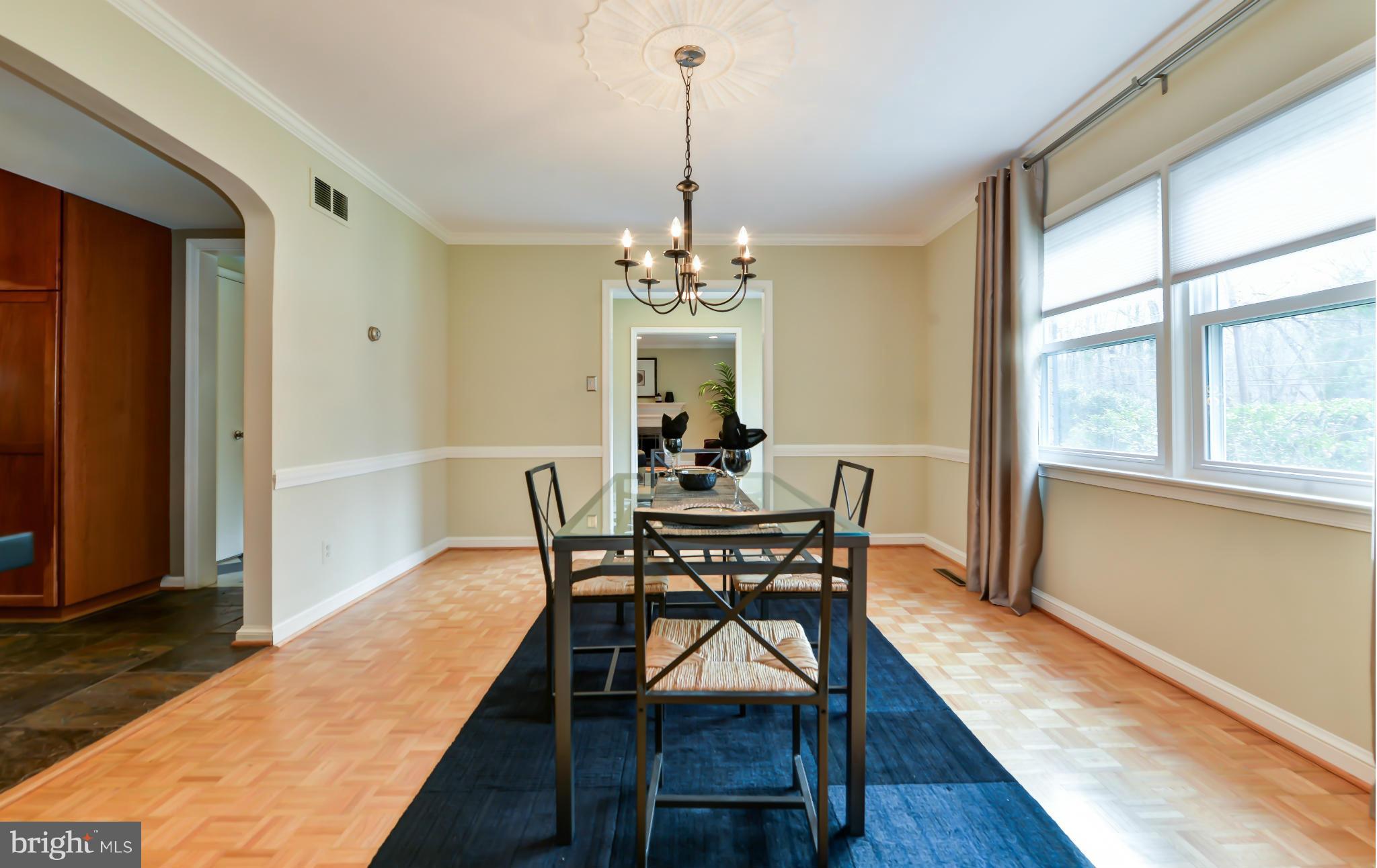 7303 Fort Hunt Road Alexandria, VA 22307 - Photo 7 of 30 a dining room with furniture window wooden floor