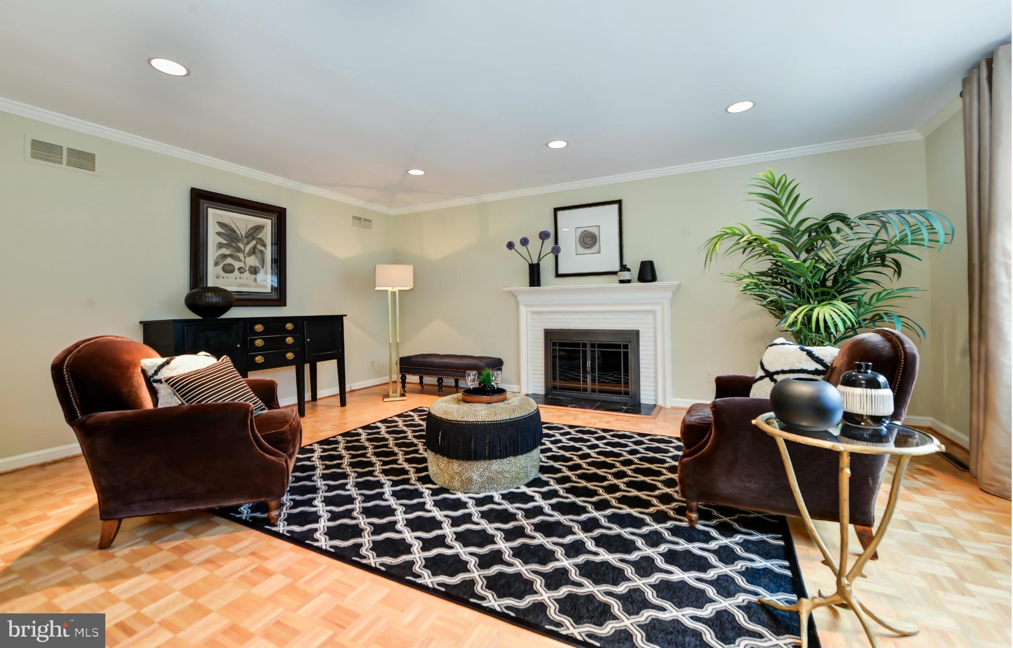 7303 Fort Hunt Road Alexandria, VA 22307 - Photo 8 of 30 a living room with furniture a rug and a fireplace