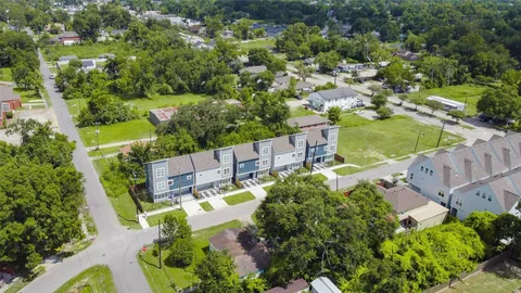 an aerial view of a house with a garden