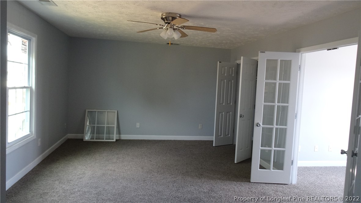 265 Hillandale Road Spring Lake, NC 28390 - Photo 22 of 28 an empty room with a empty space and windows