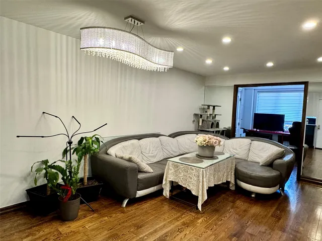 a living room with furniture flowerpot and a fireplace