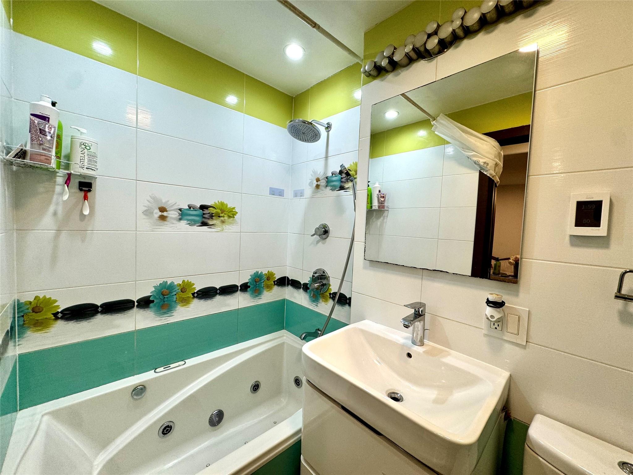 2121 Shore Parkway, Unit 4P Brooklyn, NY 11214 - Photo 15 of 20 a bathroom with a sink mirror and a bathtub