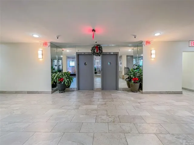 a view of a hallway with a chandelier