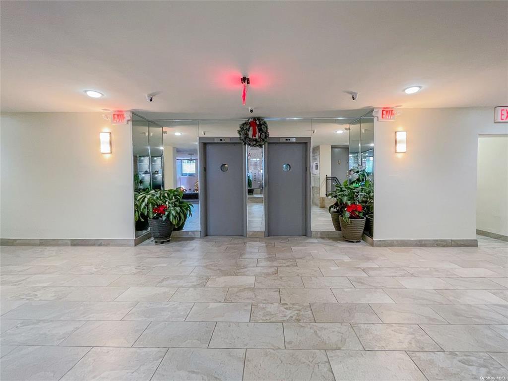 2121 Shore Parkway, Unit 4P Brooklyn, NY 11214 - Photo 19 of 20 a view of a hallway with a chandelier