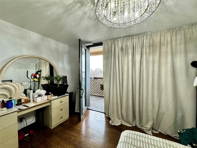 a very nice looking room with many windows and furniture