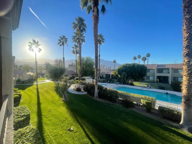a view of a swimming pool with a patio