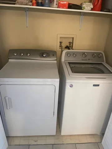 a utility room with dryer and washer