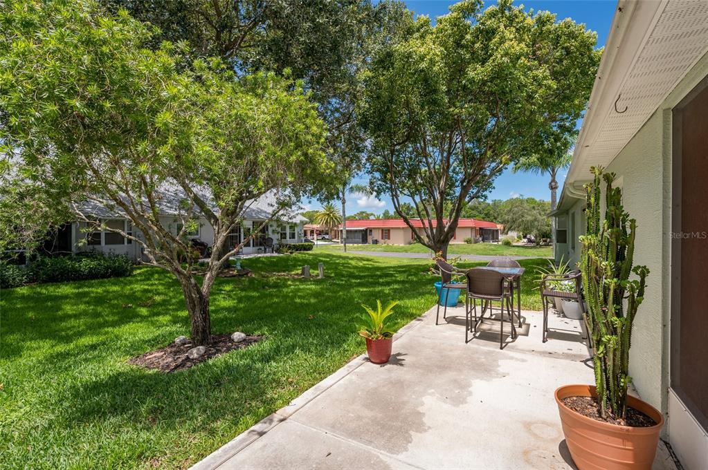 9238 Estrella Court New Port Richey, FL 34655 - Photo 34 of 37 a view of a backyard with sitting area furniture and garden