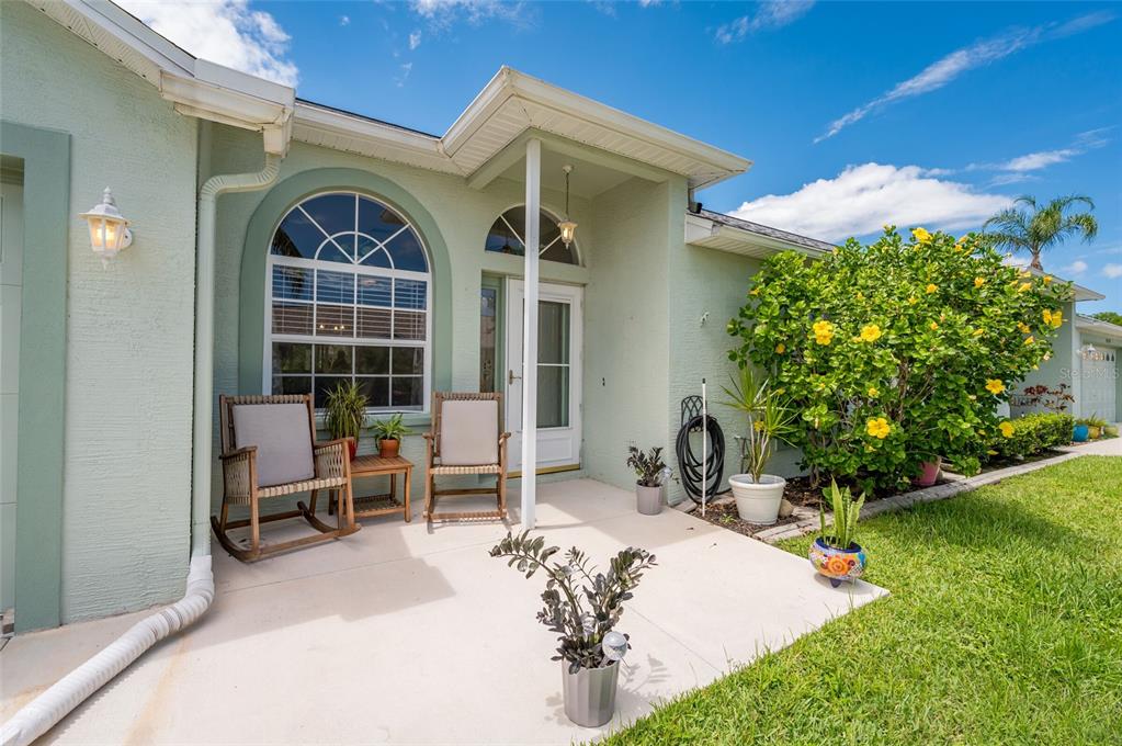 9238 Estrella Court New Port Richey, FL 34655 - Photo 4 of 37 a view of a chair and table in backyard of the house