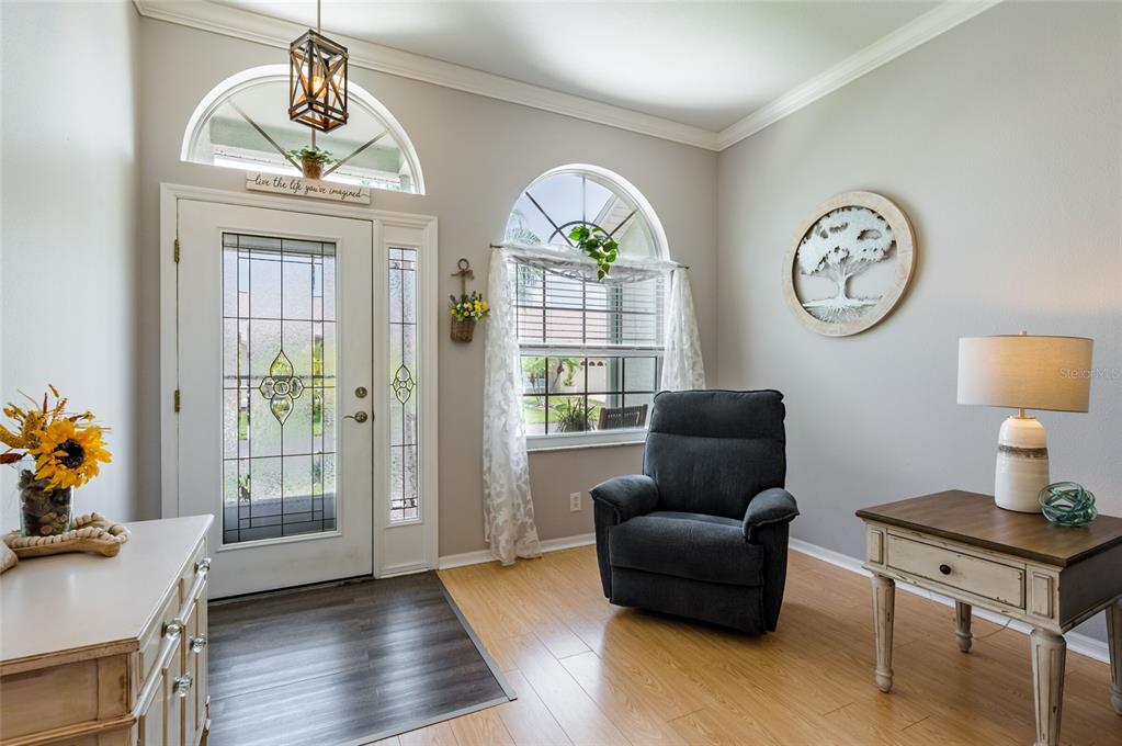 9238 Estrella Court New Port Richey, FL 34655 - Photo 7 of 37 a living room with furniture and a window
