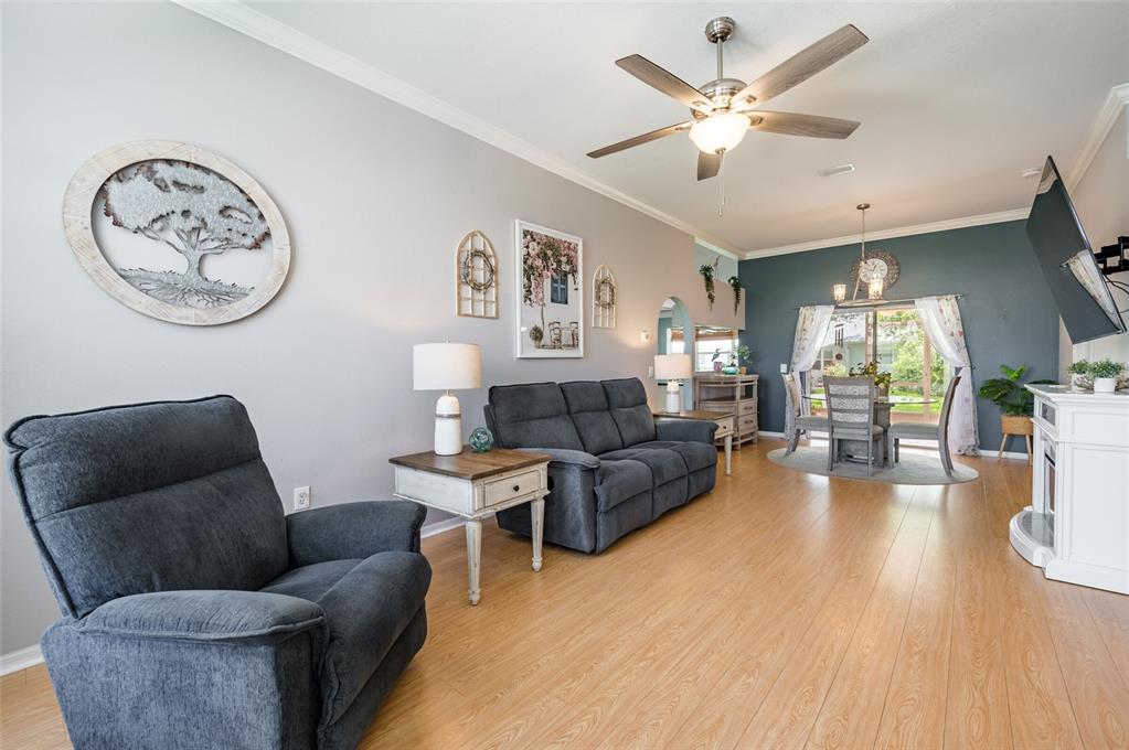 9238 Estrella Court New Port Richey, FL 34655 - Photo 8 of 37 a living room with furniture and a wooden floor