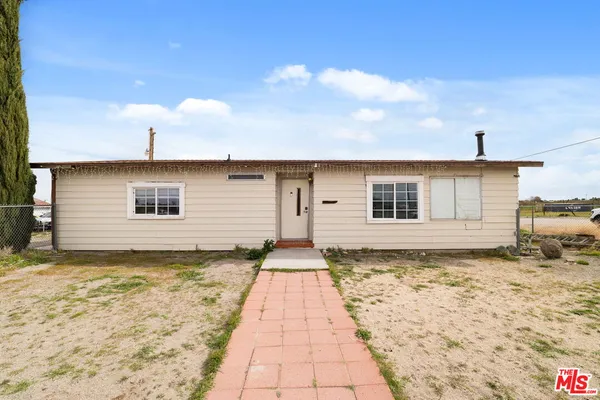 a front view of a house with yard