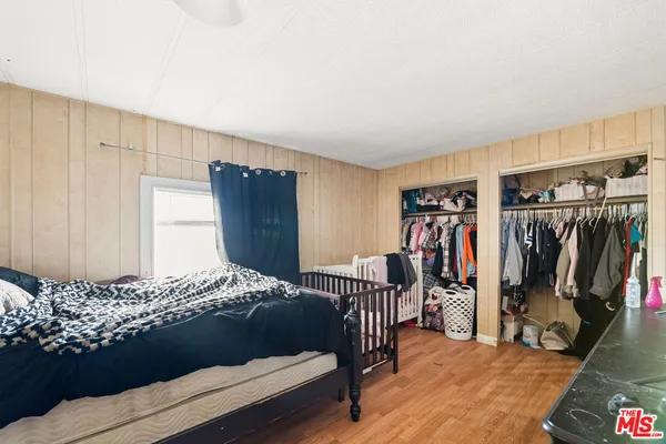 a bedroom with a bed and a walk in closet