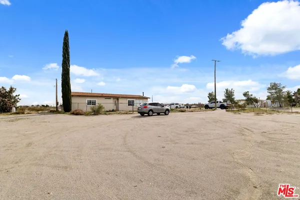 a view of parking space with parked cars