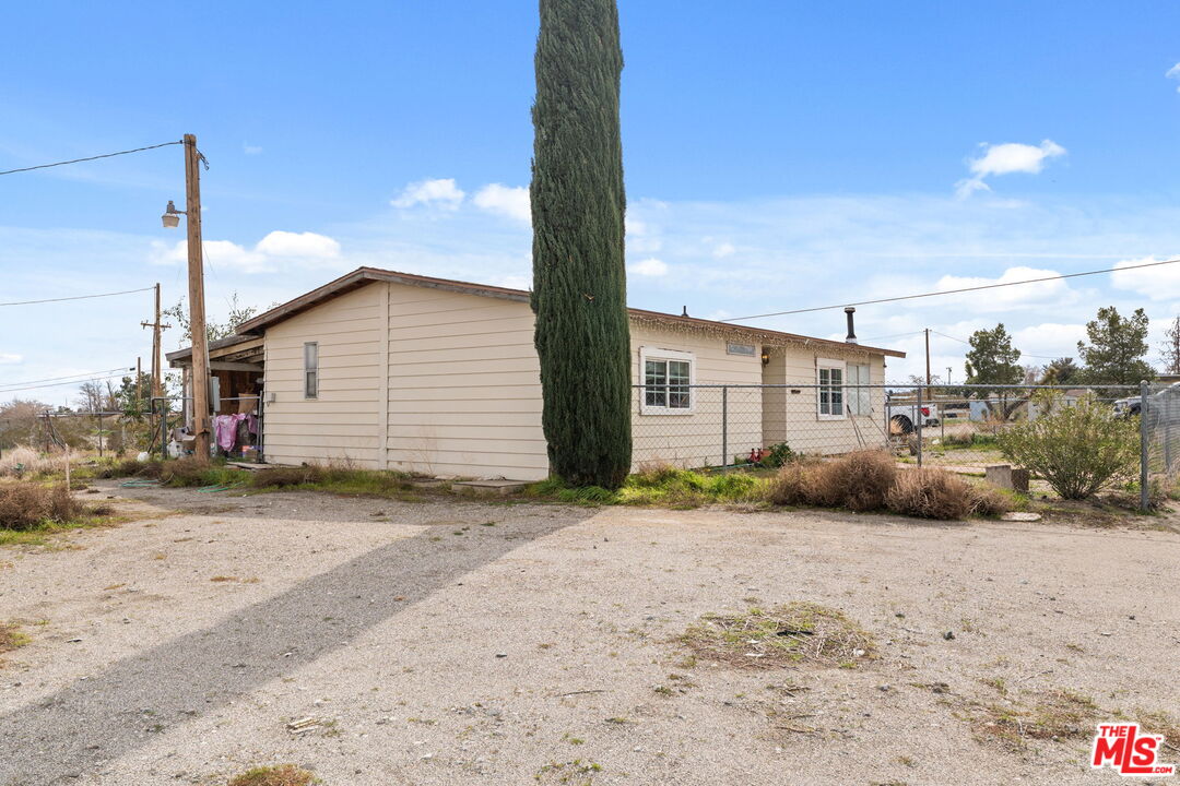 4120 La Mesa Road Phelan, CA 92371 - Photo 4 of 30 a front view of a house with a yard