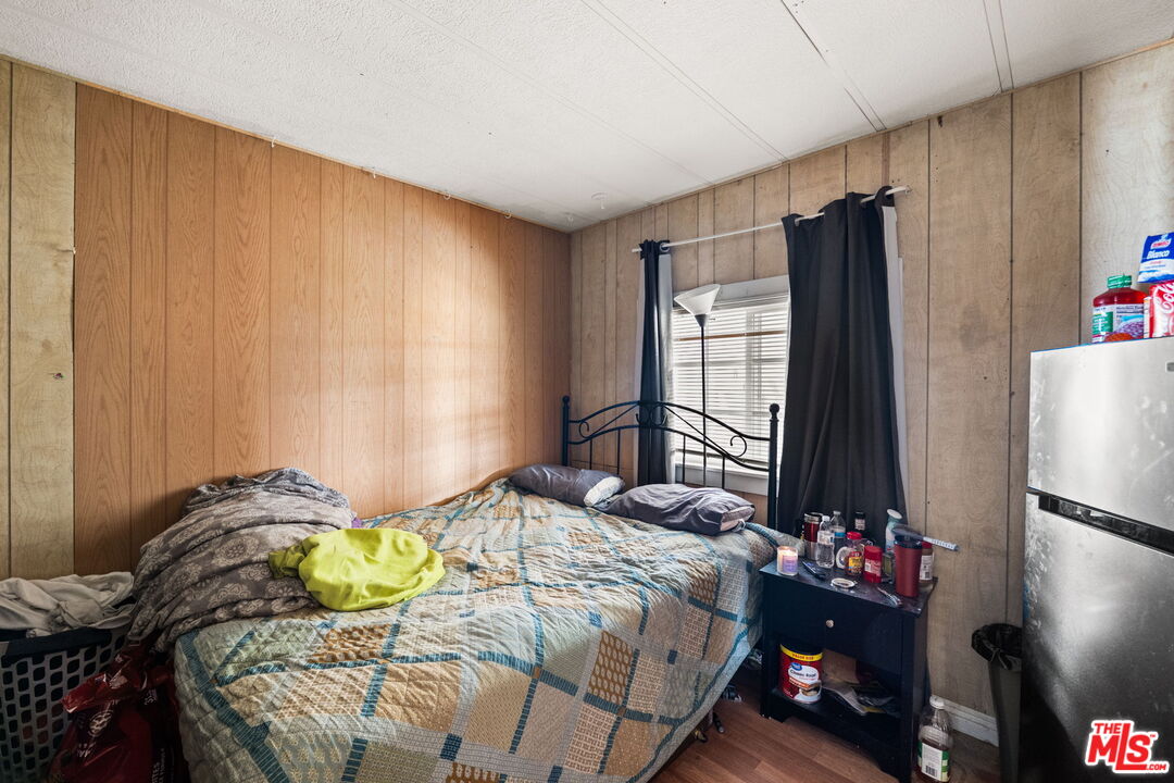 4120 La Mesa Road Phelan, CA 92371 - Photo 10 of 30 a bedroom with a bed dresser and a window