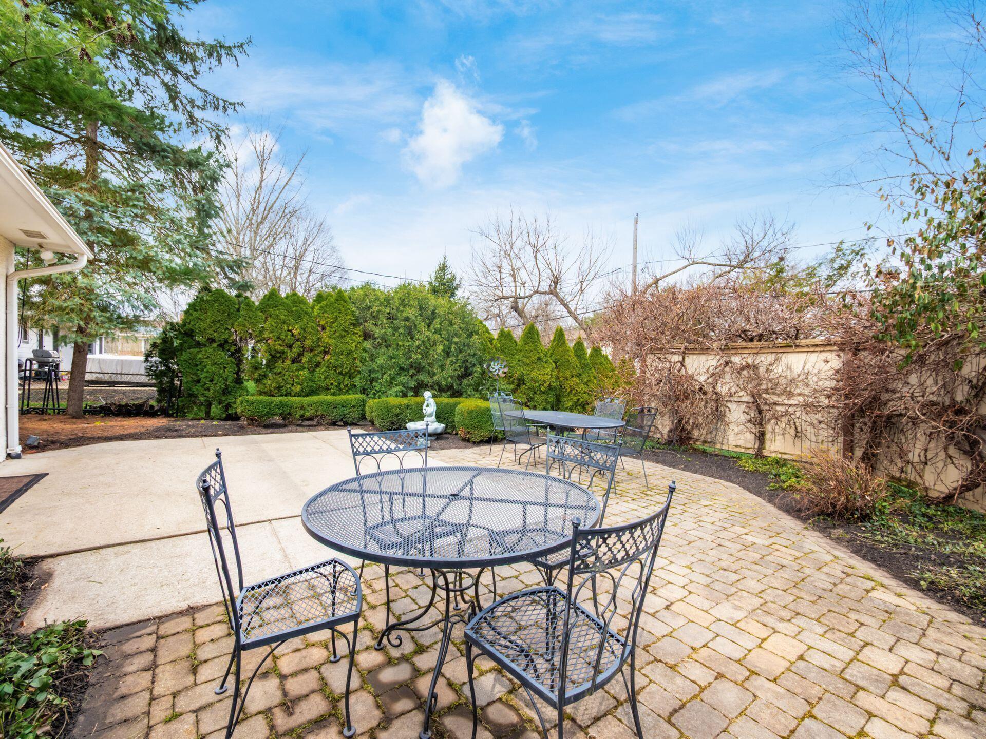 880 Lynbrook Road Columbus, OH 43235 - Photo 51 of 59 Privacy Fenced Area with climbing flowering Wisteria and Arborvitae!