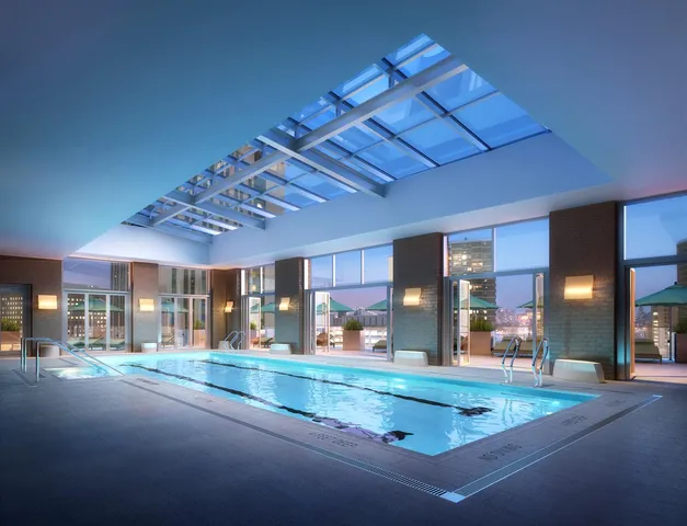 a living room with furniture and large windows