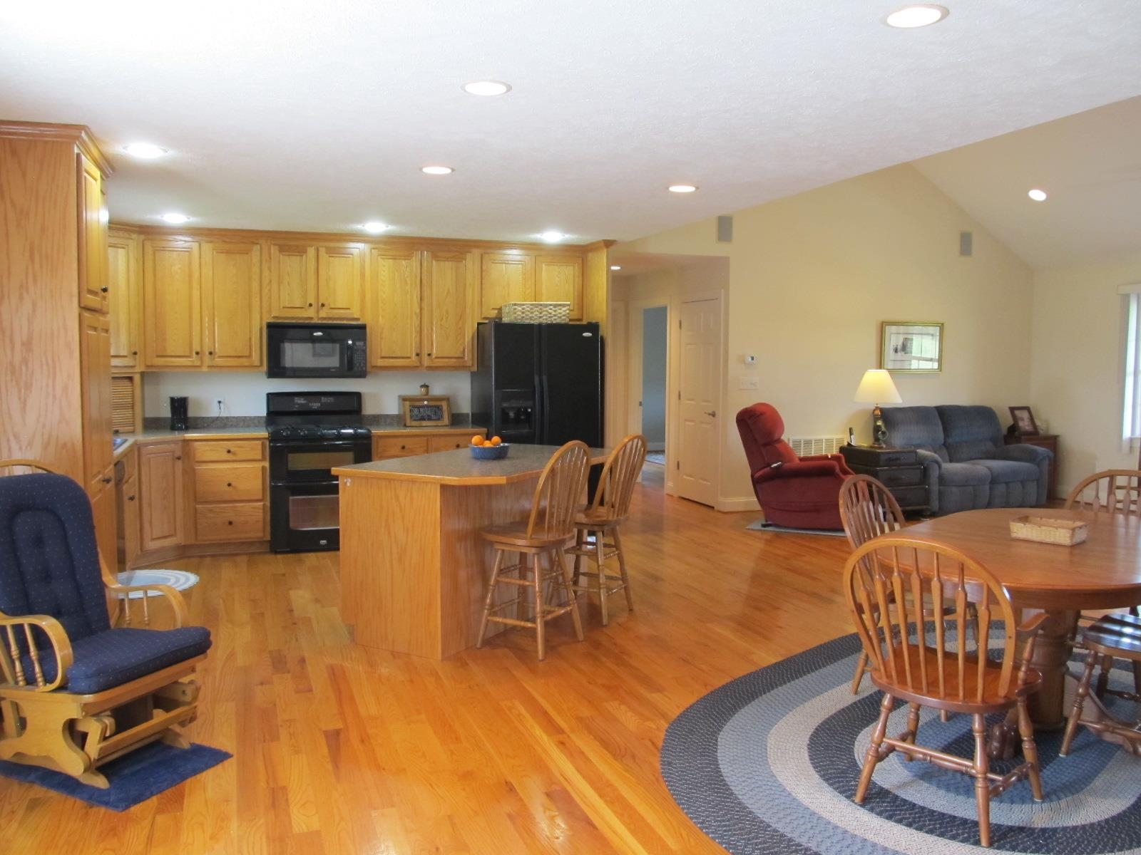 458 St James Road Fishersville, VA 22939 - Photo 11 of 61 a living room with furniture a flat screen tv and kitchen view