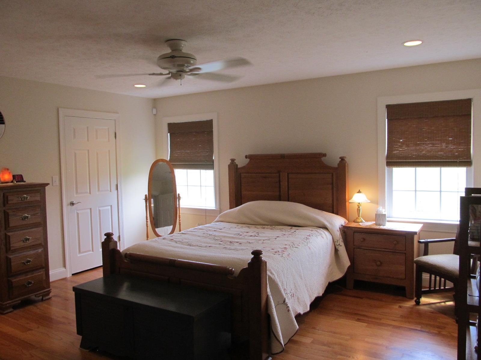 458 St James Road Fishersville, VA 22939 - Photo 19 of 61 a bedroom with a bed and a chandelier