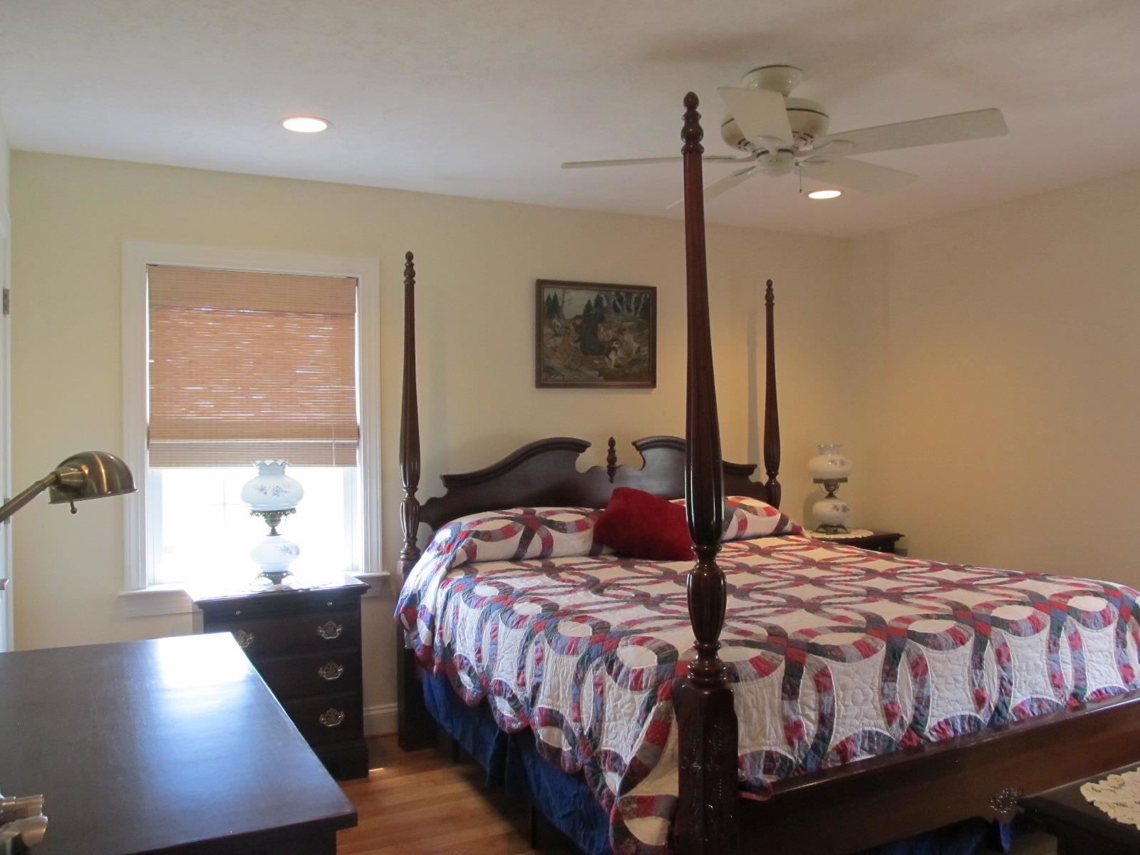 458 St James Road Fishersville, VA 22939 - Photo 26 of 61 a bedroom with a bed a lamp and a window