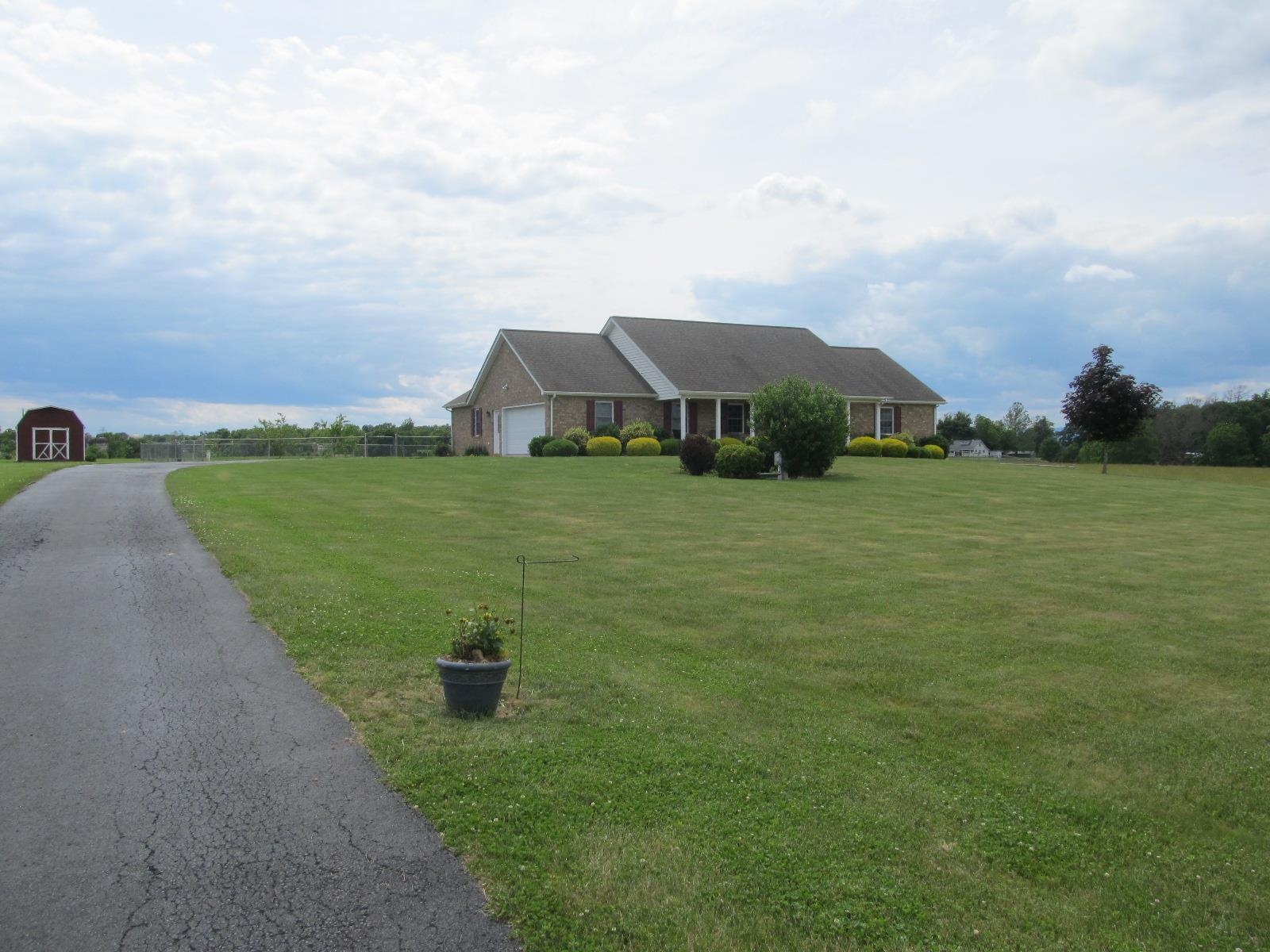 458 St James Road Fishersville, VA 22939 - Photo 56 of 61 a view of a garden with a building in the background