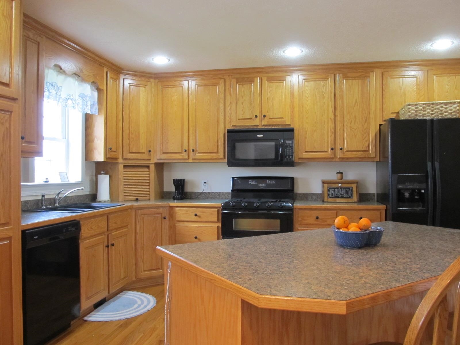 458 St James Road Fishersville, VA 22939 - Photo 10 of 61 a kitchen with stainless steel appliances granite countertop a sink a stove a refrigerator a microwave and cabinets