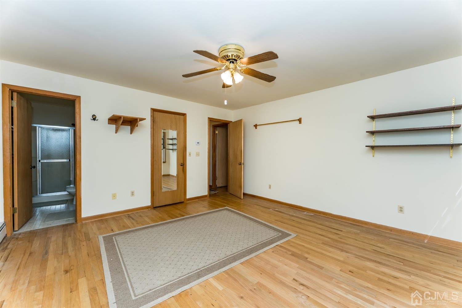 19 Russling Road Hackettstown, NJ 07840 - Photo 16 of 27 a view of empty room with wooden floor