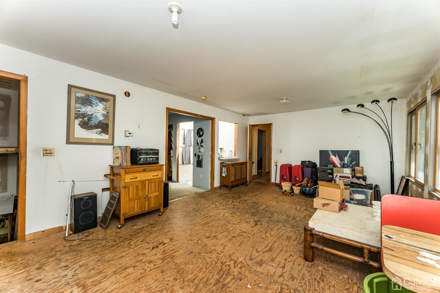 19 Russling Road Hackettstown, NJ 07840 - Photo 19 of 27 a living room with furniture and a flat screen tv