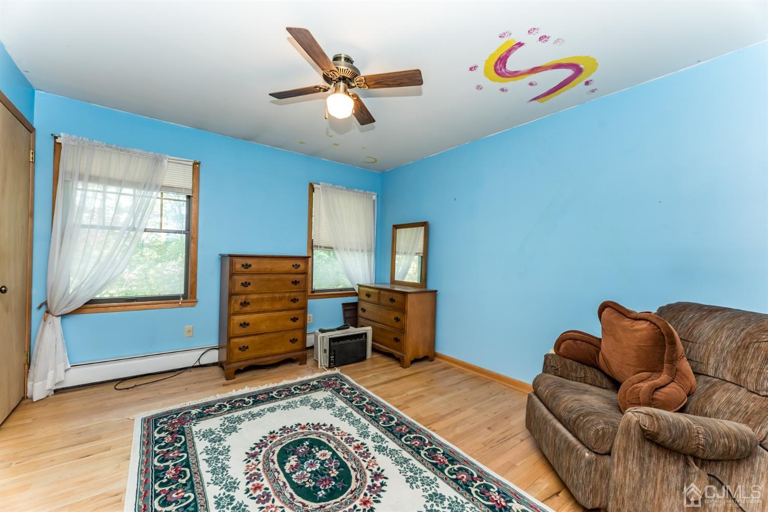 19 Russling Road Hackettstown, NJ 07840 - Photo 22 of 27 a living room with furniture and a window