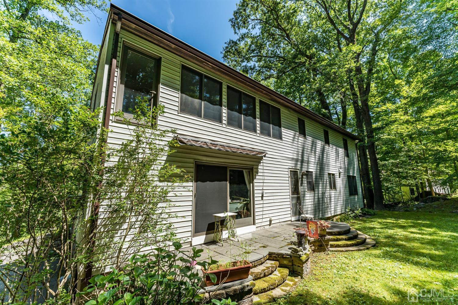 19 Russling Road Hackettstown, NJ 07840 - Photo 25 of 27 a front view of a house with garden