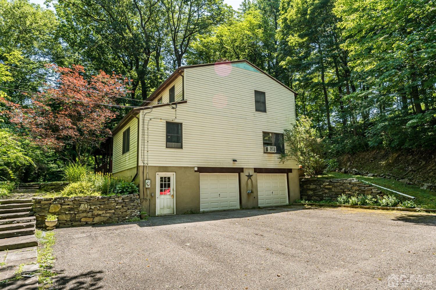 19 Russling Road Hackettstown, NJ 07840 - Photo 27 of 27 a front view of a house with a yard and garage