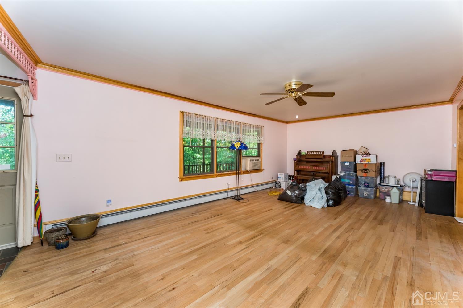 19 Russling Road Hackettstown, NJ 07840 - Photo 5 of 27 a view of a livingroom with furniture and a flat screen tv