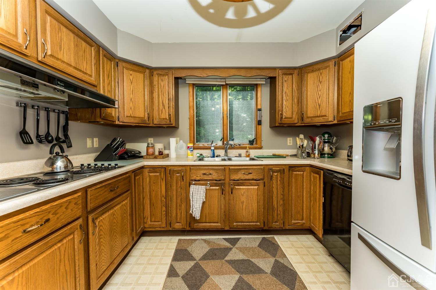 19 Russling Road Hackettstown, NJ 07840 - Photo 6 of 27 a kitchen with stainless steel appliances granite countertop a refrigerator sink and cabinets