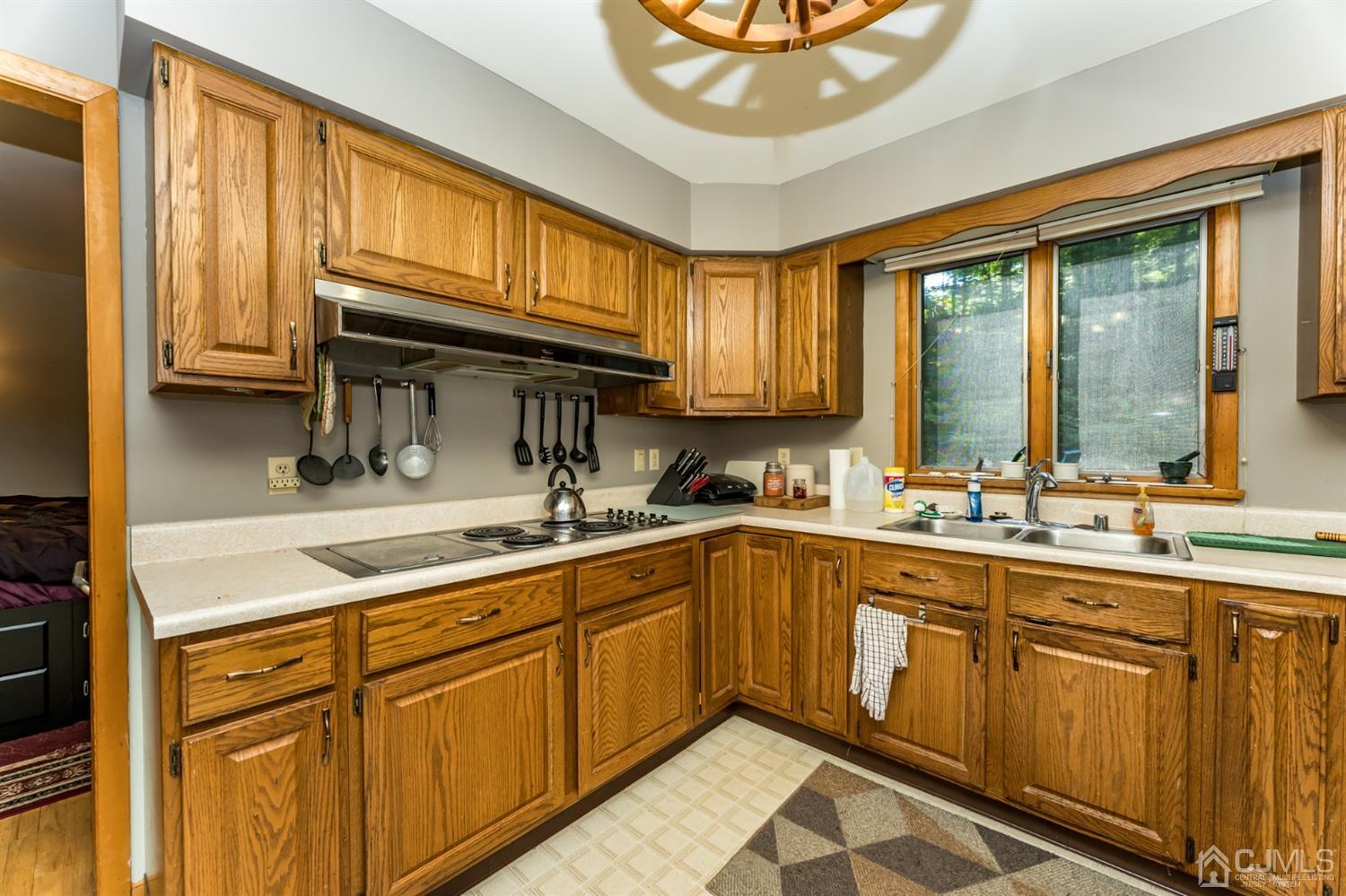 19 Russling Road Hackettstown, NJ 07840 - Photo 7 of 27 a kitchen with a sink cabinets and window