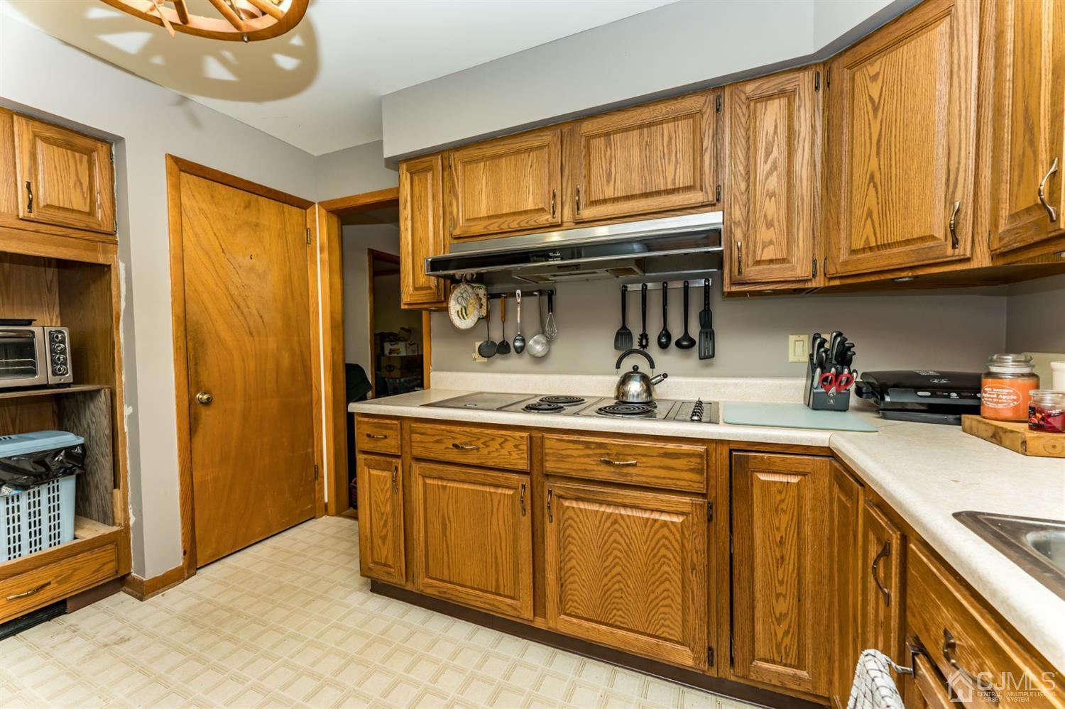 19 Russling Road Hackettstown, NJ 07840 - Photo 8 of 27 a kitchen with stainless steel appliances granite countertop a sink and cabinets
