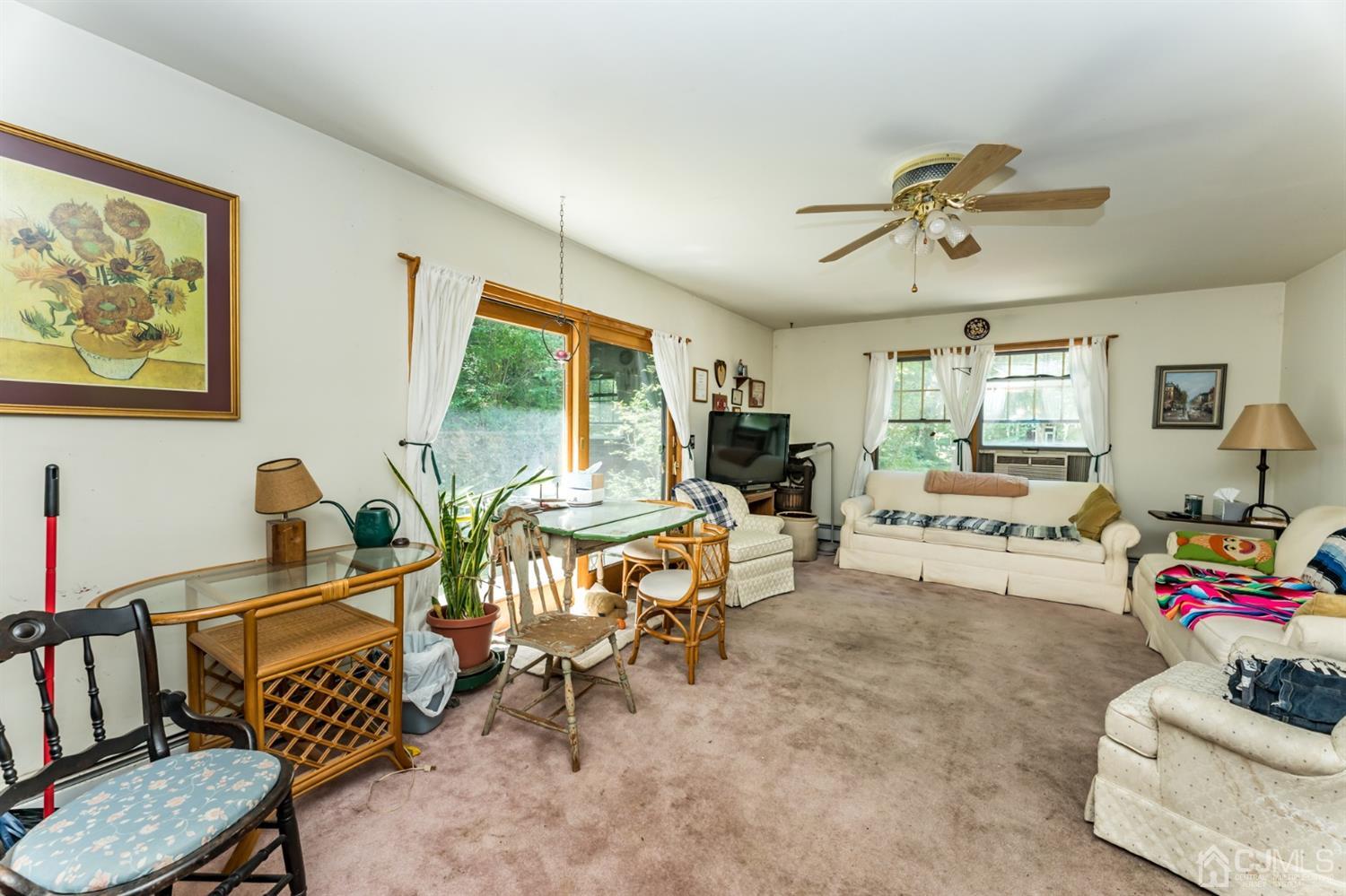 19 Russling Road Hackettstown, NJ 07840 - Photo 9 of 27 a living room with furniture and a large window