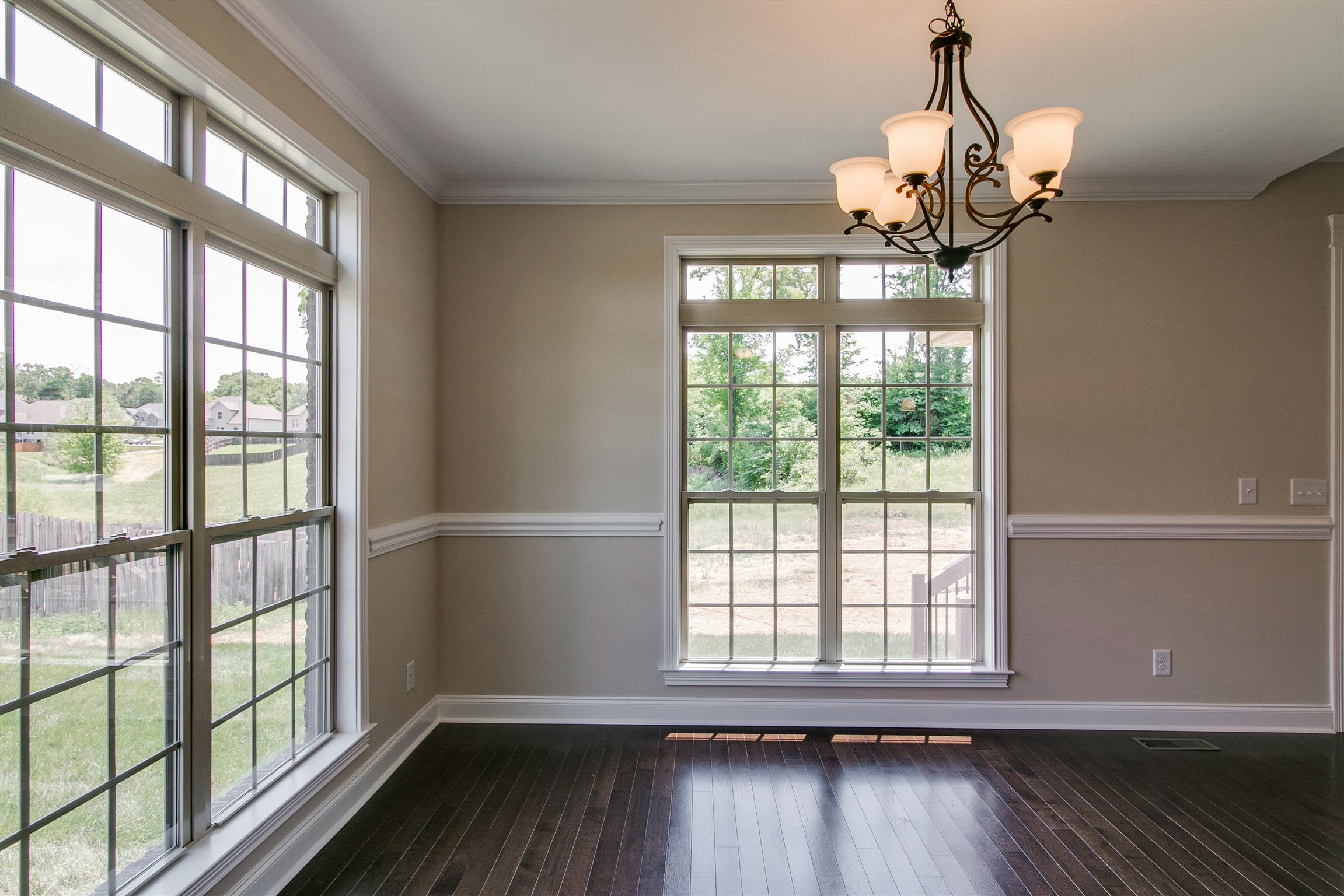 3548 Drake Road Adams, TN 37010 - Photo 11 of 30 a view of a room with wooden floor and chandelier