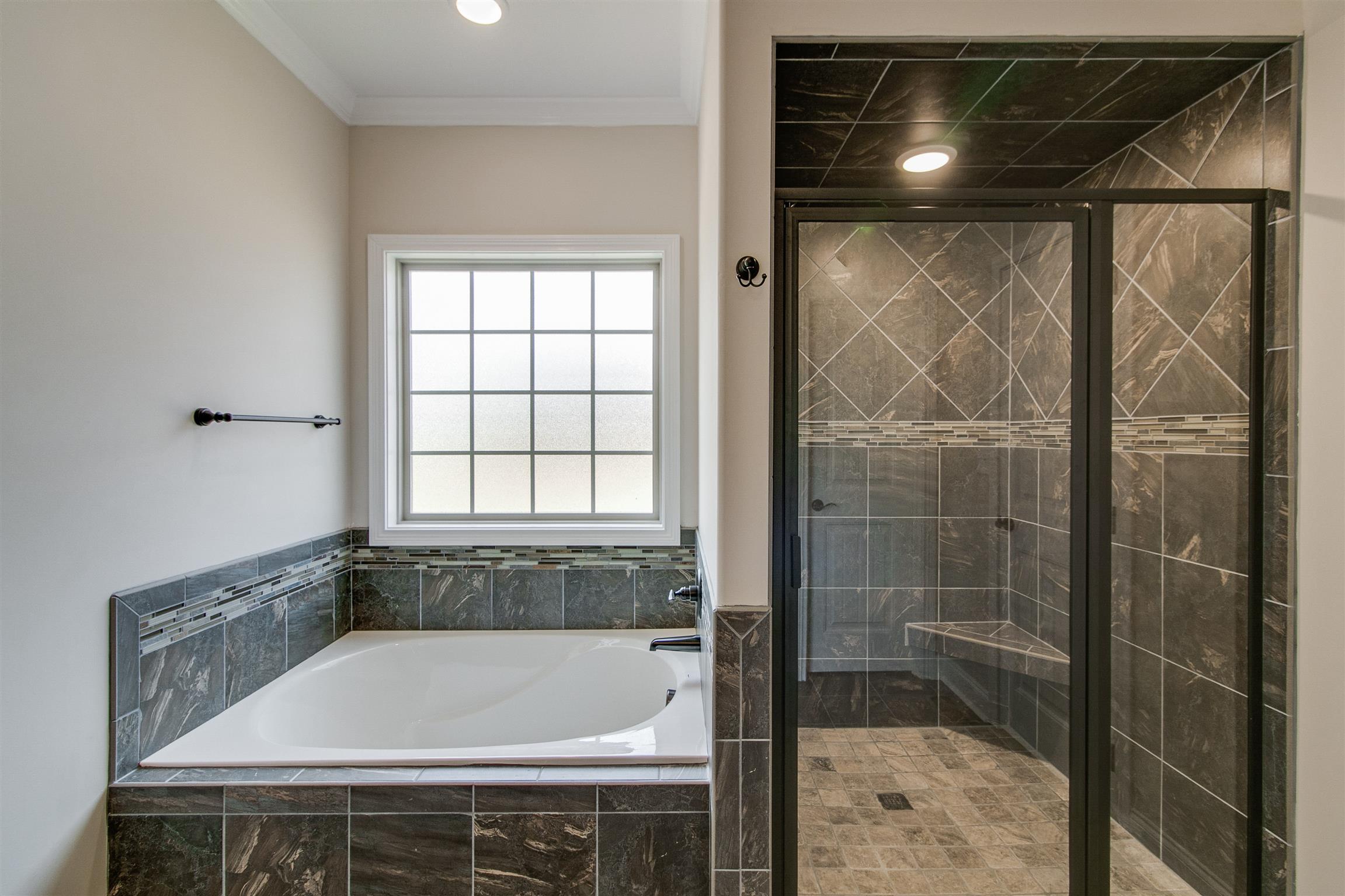 3548 Drake Road Adams, TN 37010 - Photo 20 of 30 a bathroom with a bathtub and shower