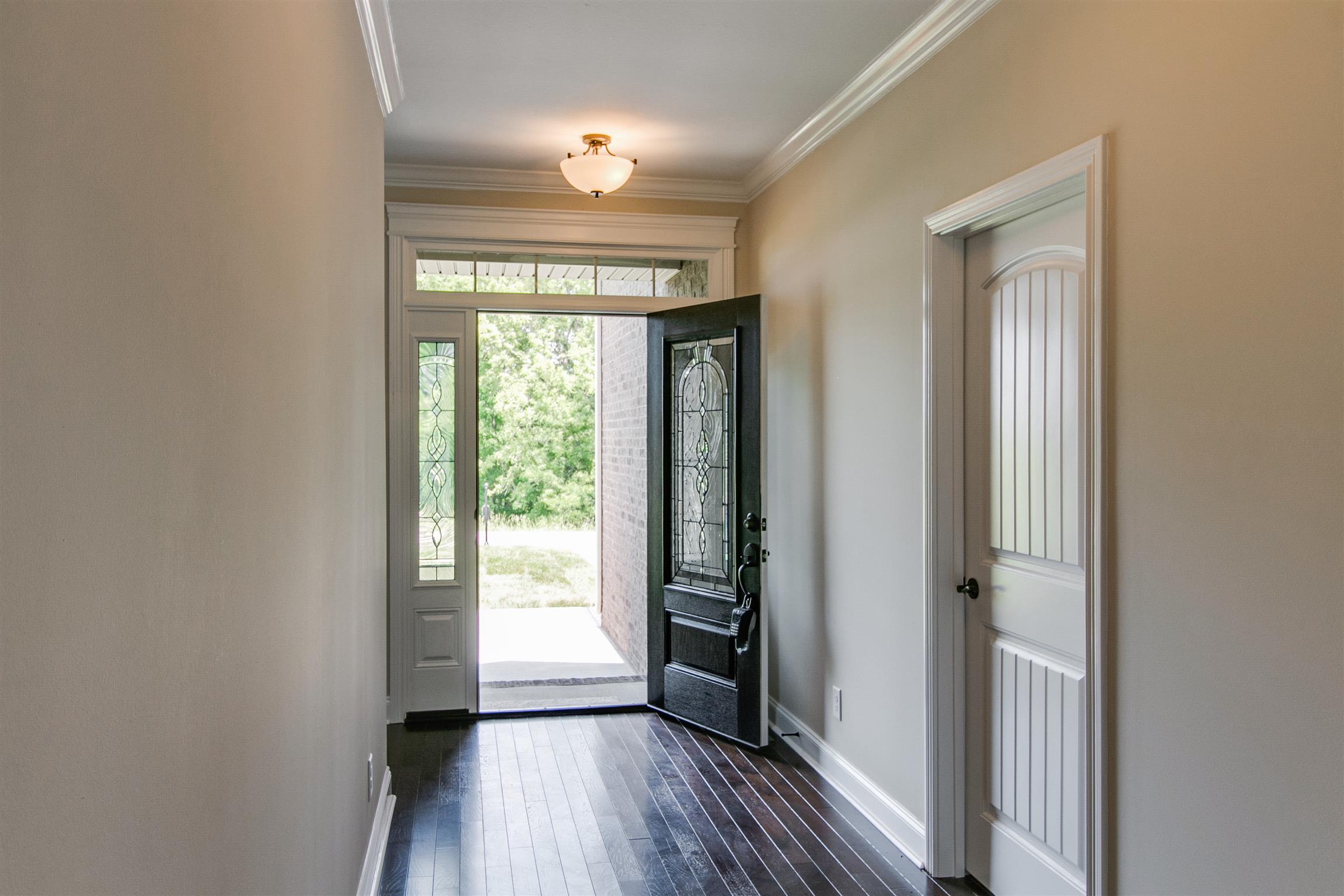 3548 Drake Road Adams, TN 37010 - Photo 4 of 30 a view of hallway with a large window and wooden floor