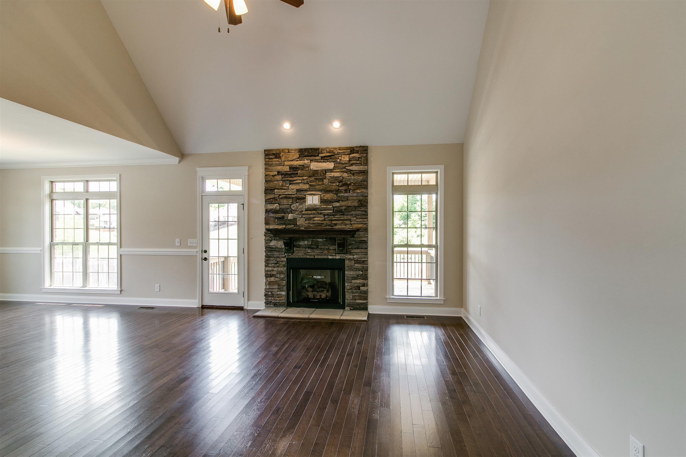 3548 Drake Road Adams, TN 37010 - Photo 5 of 30 an empty room with wooden floor and windows