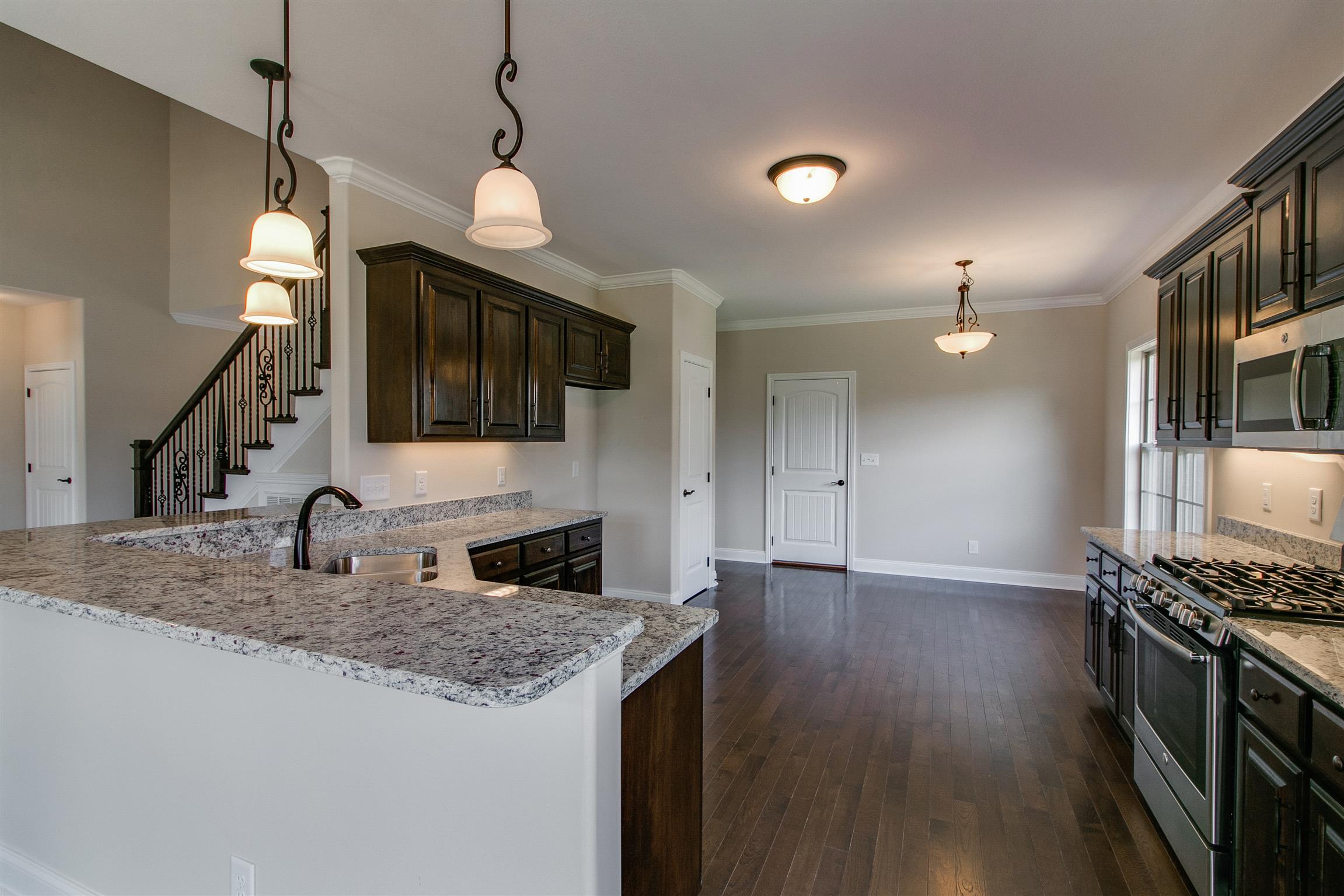 3548 Drake Road Adams, TN 37010 - Photo 8 of 30 a kitchen with stainless steel appliances granite countertop a sink stove and refrigerator