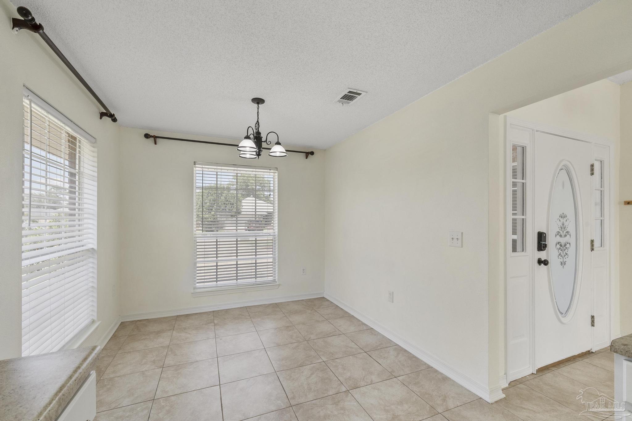 4769 Ribault Lane Milton, FL 32570 - Photo 17 of 34 a view of an empty room with a window
