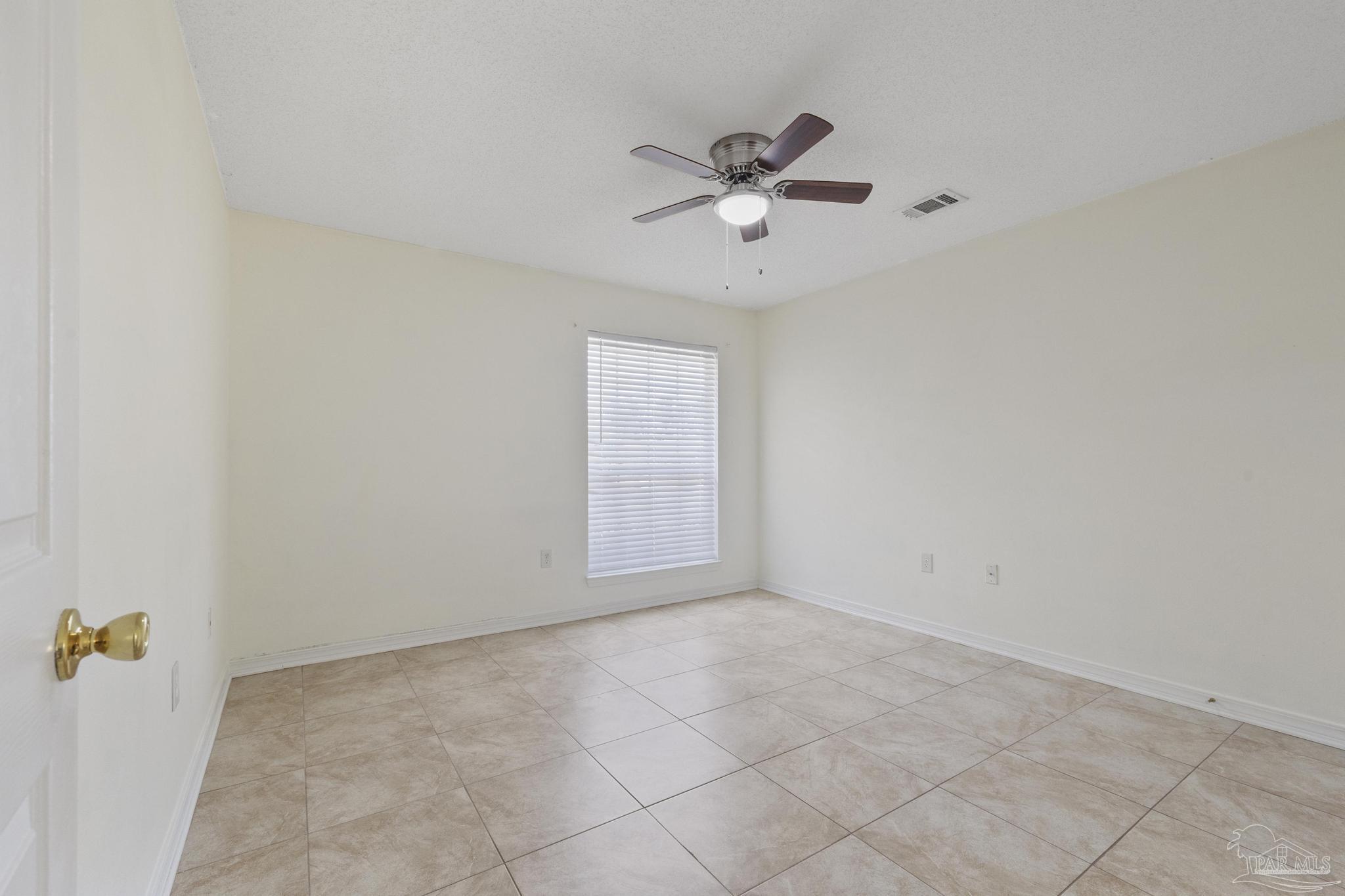 4769 Ribault Lane Milton, FL 32570 - Photo 18 of 34 a view of an empty room with a window