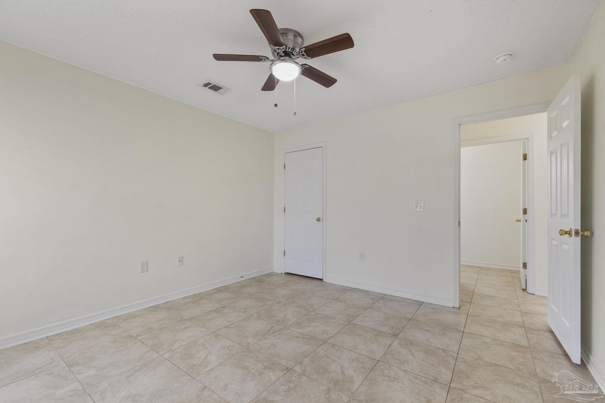 4769 Ribault Lane Milton, FL 32570 - Photo 19 of 34 wooden floor in an empty room