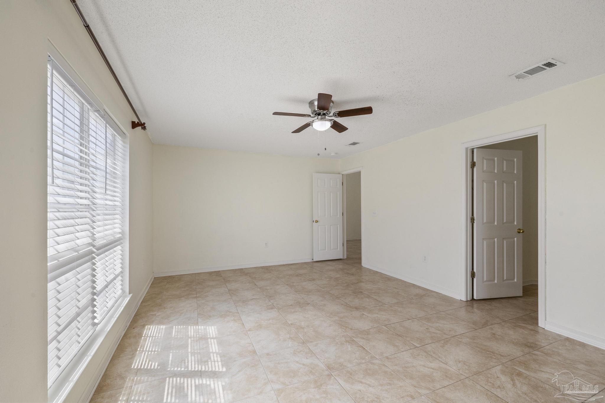 4769 Ribault Lane Milton, FL 32570 - Photo 22 of 34 a view of room with a ceiling fan