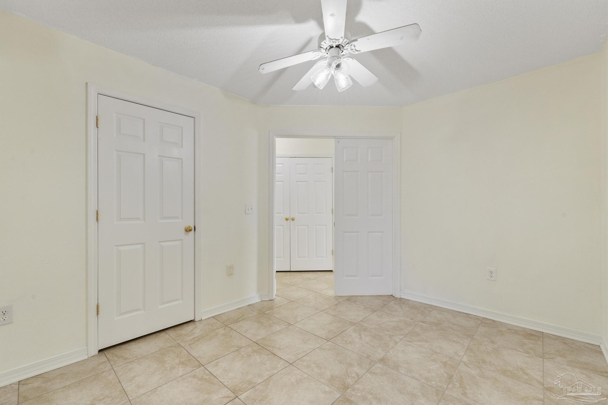 4769 Ribault Lane Milton, FL 32570 - Photo 25 of 34 an empty room with fan